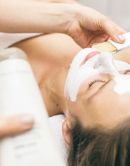 Woman making facial treatment in a beauty saloon